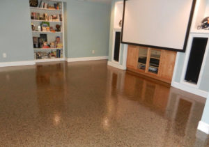 A basement has a new epoxy floor coating.